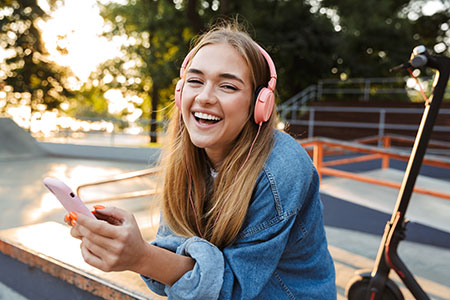 Teenager smiling while listening to music